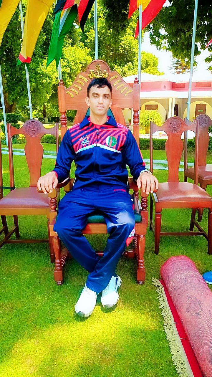 Coach in his national squad tracksuit at a tournament venue