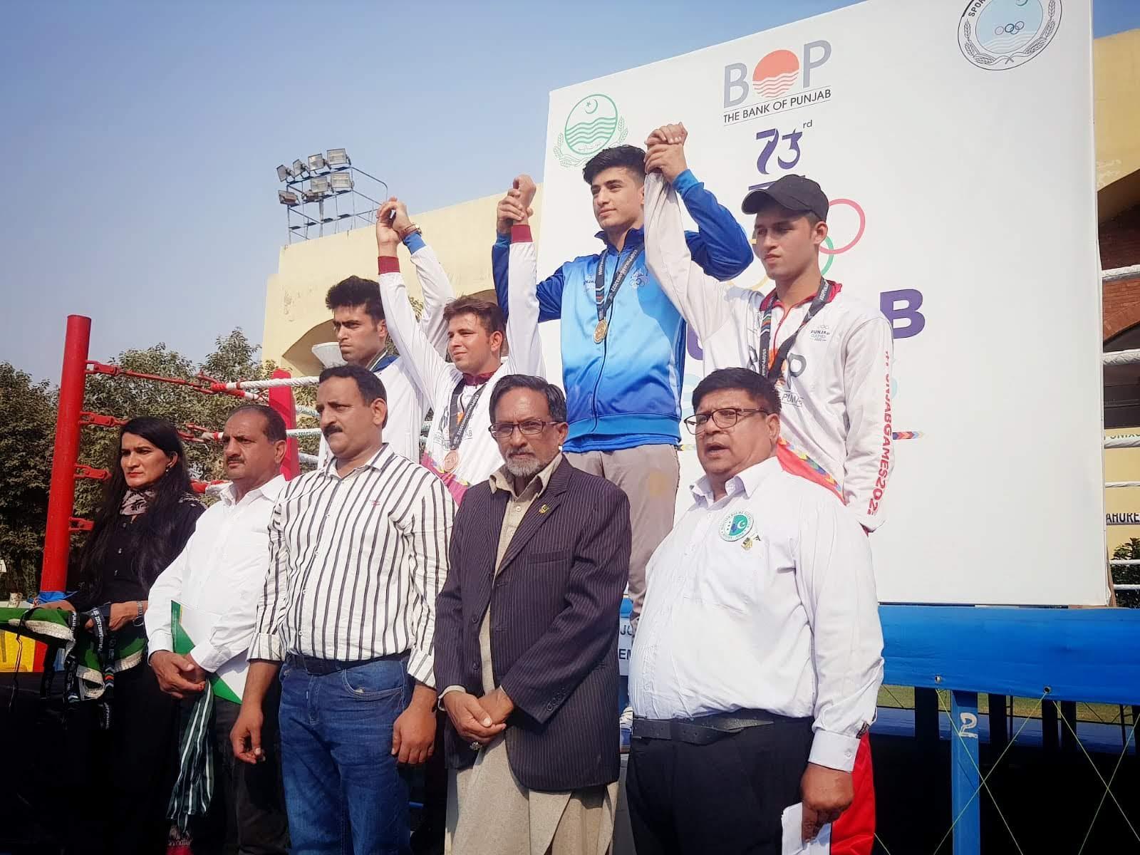 Gym boxer on the podium with the gold medal at the Punjab Games