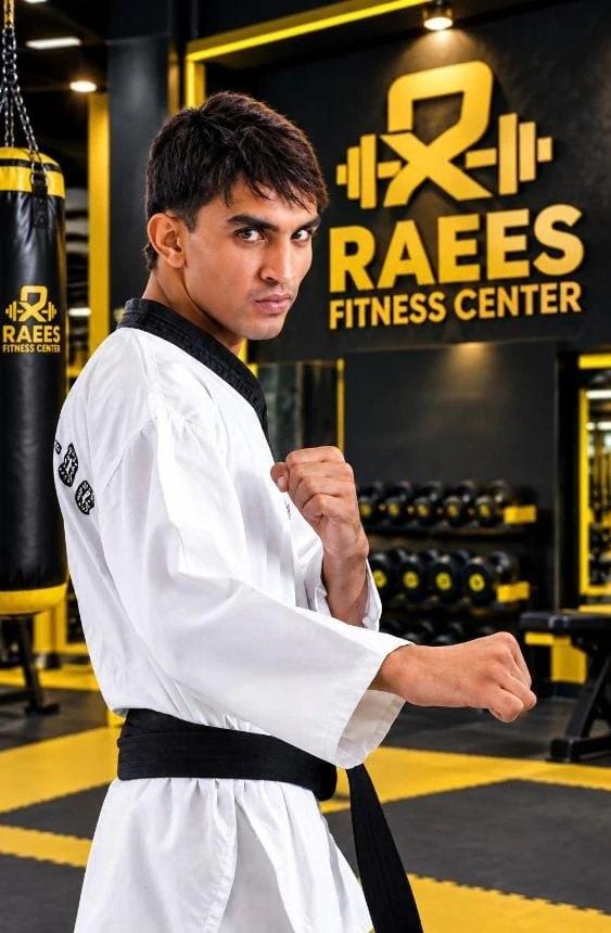 Taekwondo black belt in guard on the matted area at Raees Fitness Center