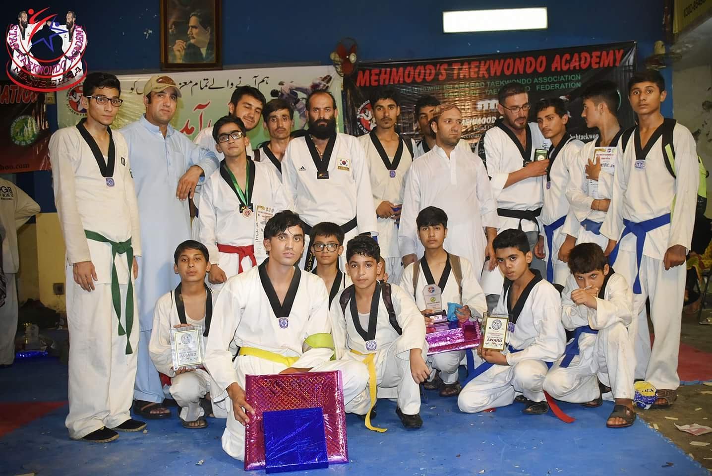 Group photograph from a taekwondo grading and awards ceremony